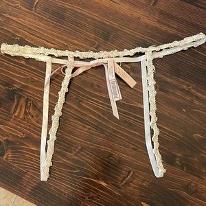 Victoria’s Secret flower detail, garter belt.